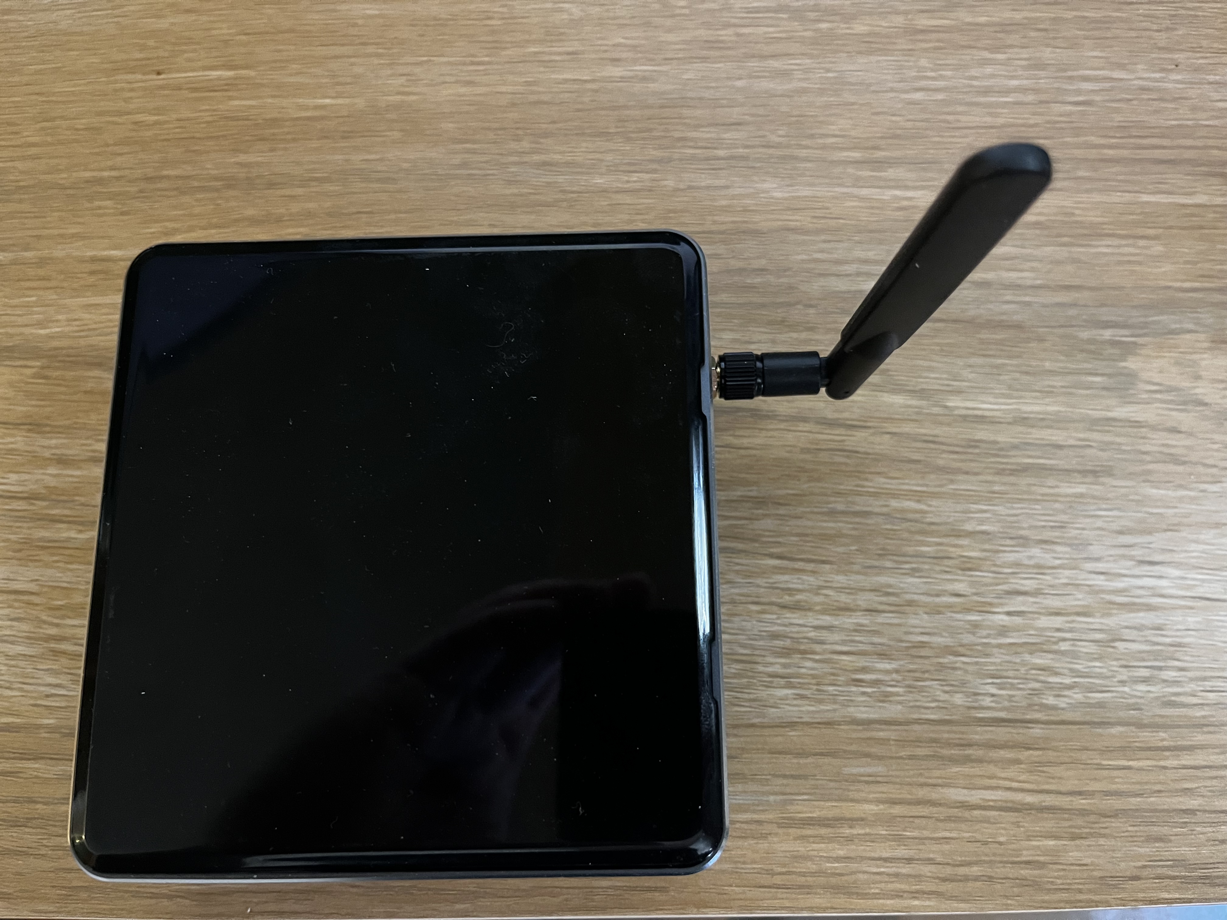Photo of an Intel NUC with an external antenna